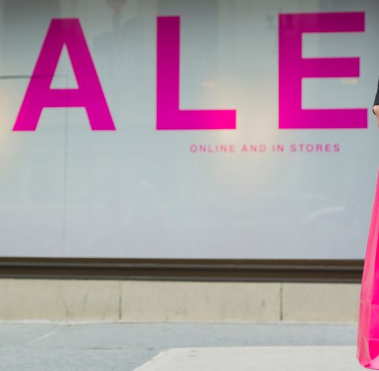 woman-with-shopping-bags-near-sale-lettering_23-2147932257